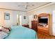 Bright bedroom featuring a king-size bed and built-in entertainment center at 11596 W Sierra Dawn Blvd # 134, Surprise, AZ 85378