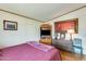 Bedroom with a queen-size bed, dresser, and large artwork at 11596 W Sierra Dawn Blvd # 134, Surprise, AZ 85378