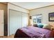 Bedroom with a double bed, window, and large closet at 11596 W Sierra Dawn Blvd # 134, Surprise, AZ 85378