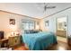 Bedroom with a full-size bed, en-suite bathroom access, and window at 11596 W Sierra Dawn Blvd # 134, Surprise, AZ 85378