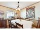 Charming dining room with wood table and chairs, and southwestern decor at 11596 W Sierra Dawn Blvd # 134, Surprise, AZ 85378