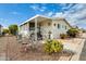Attractive manufactured home with covered carport and well-maintained landscaping at 11596 W Sierra Dawn Blvd # 134, Surprise, AZ 85378