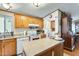 Kitchen with island, oak cabinets, and appliances at 11596 W Sierra Dawn Blvd # 134, Surprise, AZ 85378