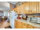 Kitchen features wood cabinets and appliances at 11596 W Sierra Dawn Blvd # 134, Surprise, AZ 85378