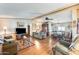 Open living room and dining area with hardwood floors and ceiling fan at 11596 W Sierra Dawn Blvd # 134, Surprise, AZ 85378