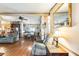 Open living room with hardwood floors, dining area, and cozy seating at 11596 W Sierra Dawn Blvd # 134, Surprise, AZ 85378