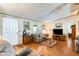 Spacious living room with hardwood floors, comfy seating, and a flat-screen TV at 11596 W Sierra Dawn Blvd # 134, Surprise, AZ 85378