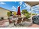 Relaxing patio with seating area, umbrella, and BBQ at 11596 W Sierra Dawn Blvd # 134, Surprise, AZ 85378