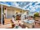 Backyard patio with seating, table, and a covered structure at 11596 W Sierra Dawn Blvd # 134, Surprise, AZ 85378