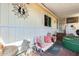 Relaxing covered patio with seating, hot tub, and desert landscaping at 11596 W Sierra Dawn Blvd # 134, Surprise, AZ 85378