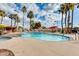 Community swimming pool and spa with ample lounge chairs at 11596 W Sierra Dawn Blvd # 134, Surprise, AZ 85378