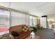 Bright sunroom with wicker furniture and view of the backyard at 11596 W Sierra Dawn Blvd # 134, Surprise, AZ 85378