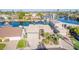 Aerial view of a waterfront home with private dock and lush landscaping at 1412 E Commodore Pl, Tempe, AZ 85283