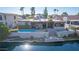 Aerial view of house, pool, and private dock on waterfront at 1412 E Commodore Pl, Tempe, AZ 85283