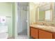 Bathroom with shower, granite vanity, and large mirror at 1412 E Commodore Pl, Tempe, AZ 85283