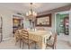 Formal dining room with chandelier and views to the kitchen at 1412 E Commodore Pl, Tempe, AZ 85283