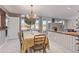 Elegant dining room with water views and a chandelier at 1412 E Commodore Pl, Tempe, AZ 85283
