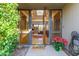 Inviting entryway with a wood door and tiled flooring at 1412 E Commodore Pl, Tempe, AZ 85283