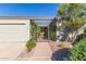 Elegant entryway with an ornate gate and well-manicured landscaping at 1412 E Commodore Pl, Tempe, AZ 85283