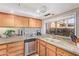 Well-equipped kitchen, granite counters, and stainless steel appliances at 1412 E Commodore Pl, Tempe, AZ 85283