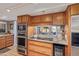 Modern kitchen featuring granite countertops and stainless steel appliances at 1412 E Commodore Pl, Tempe, AZ 85283