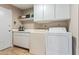 Laundry room with washer, dryer, and cabinets at 1412 E Commodore Pl, Tempe, AZ 85283