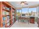 Home office with built-in bookshelves and water view at 1412 E Commodore Pl, Tempe, AZ 85283