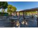Community patio with tables and chairs near pool at 1412 E Commodore Pl, Tempe, AZ 85283