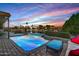 Relaxing backyard oasis with a sparkling pool, patio furniture, and water views at 1412 E Commodore Pl, Tempe, AZ 85283