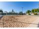 Outdoor sand volleyball court with net at 1412 E Commodore Pl, Tempe, AZ 85283