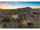 Sunset aerial view of a luxury property on several acres at 14236 E Ranch Rd, Scottsdale, AZ 85262