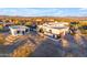 Stunning aerial view of a two-building home with desert landscape at 14236 E Ranch Rd, Scottsdale, AZ 85262