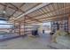 Well-maintained barn with storage area for hay and animal supplies at 14236 E Ranch Rd, Scottsdale, AZ 85262