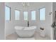 Relaxing bathroom with freestanding tub and large windows at 14236 E Ranch Rd, Scottsdale, AZ 85262