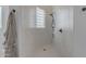 Spa-like bathroom with a large walk-in shower and glass block window at 14236 E Ranch Rd, Scottsdale, AZ 85262