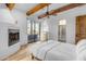 Bedroom with fireplace and access to private patio at 14236 E Ranch Rd, Scottsdale, AZ 85262