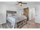 Bedroom with rustic bed frame and barn door to closet at 14236 E Ranch Rd, Scottsdale, AZ 85262