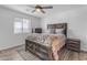 Bedroom with rustic wooden bed frame and ceiling fan at 14236 E Ranch Rd, Scottsdale, AZ 85262