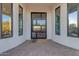 Modern entry door with a view into the home's interior at 14236 E Ranch Rd, Scottsdale, AZ 85262