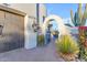 Inviting entryway with an arched walkway and landscaping at 14236 E Ranch Rd, Scottsdale, AZ 85262