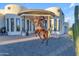 A metal sculpture accents the home's unique exterior design at 14236 E Ranch Rd, Scottsdale, AZ 85262