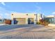 Front view of a beautiful home with a large driveway and landscaping at 14236 E Ranch Rd, Scottsdale, AZ 85262