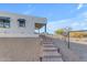 Steps leading to a modern home with mountain views and a fenced-in area at 14236 E Ranch Rd, Scottsdale, AZ 85262