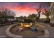 Inviting fire pit with colorful seating, perfect for outdoor gatherings at 14236 E Ranch Rd, Scottsdale, AZ 85262