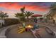 Relaxing fire pit surrounded by colorful chairs in the desert landscape at 14236 E Ranch Rd, Scottsdale, AZ 85262