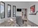 Bright home office with large windows, wood desk, and views of backyard at 14236 E Ranch Rd, Scottsdale, AZ 85262