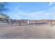 Spacious horse corral with wooden fencing and a skull detail at 14236 E Ranch Rd, Scottsdale, AZ 85262