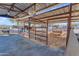 Spacious horse stable with individual stalls and shaded areas at 14236 E Ranch Rd, Scottsdale, AZ 85262