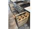 Modern kitchen boasting stainless steel appliances and custom pull-out pot storage at 14236 E Ranch Rd, Scottsdale, AZ 85262