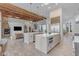 Open concept kitchen with two islands and wood beam ceilings at 14236 E Ranch Rd, Scottsdale, AZ 85262